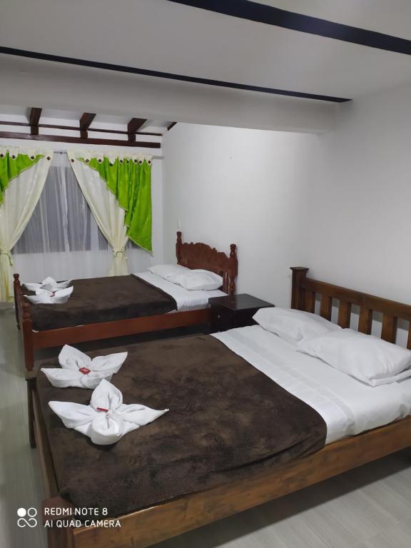 Krevet ili kreveti u jedinici u objektu Hostal Villa Rosita