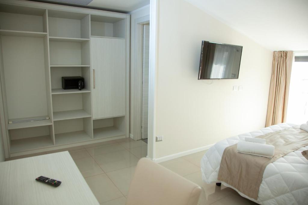 Postel nebo postele na pokoji v ubytování Hotel Dolce Stella