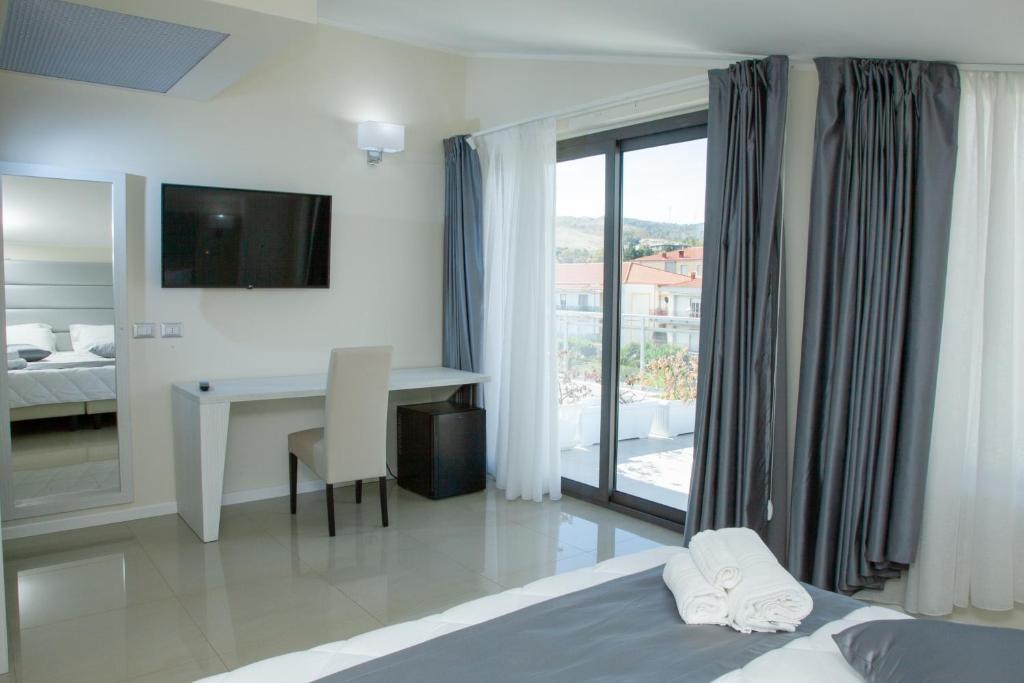 Postel nebo postele na pokoji v ubytování Hotel Dolce Stella