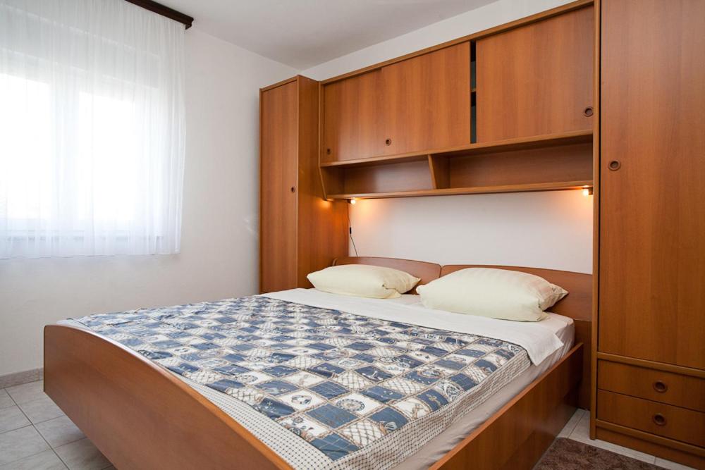 Łóżko lub łóżka w pokoju w obiekcie Apartments Mato