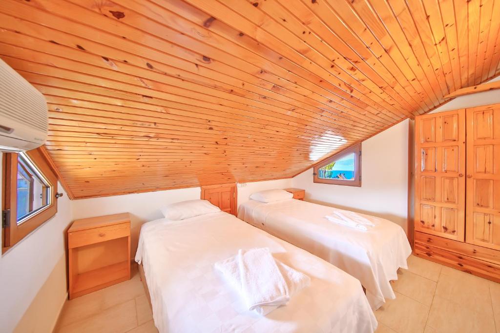 Postel nebo postele na pokoji v ubytování Villa Dundar - Kas Apartments