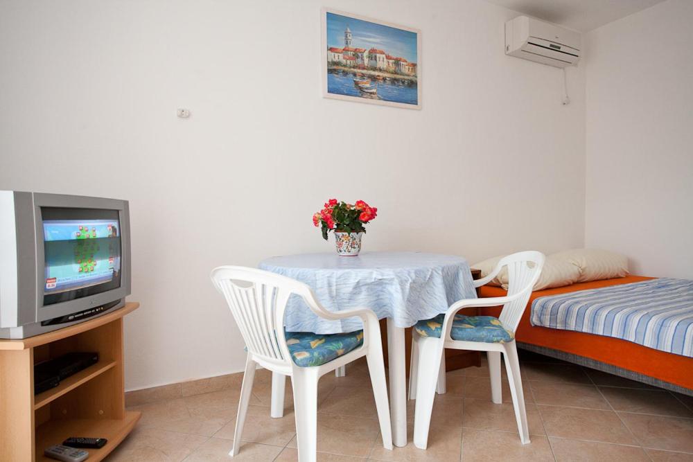 Łóżko lub łóżka w pokoju w obiekcie Apartments Mato