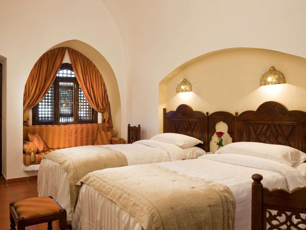 Postel nebo postele na pokoji v ubytování Movenpick Resort Sharm El Sheikh