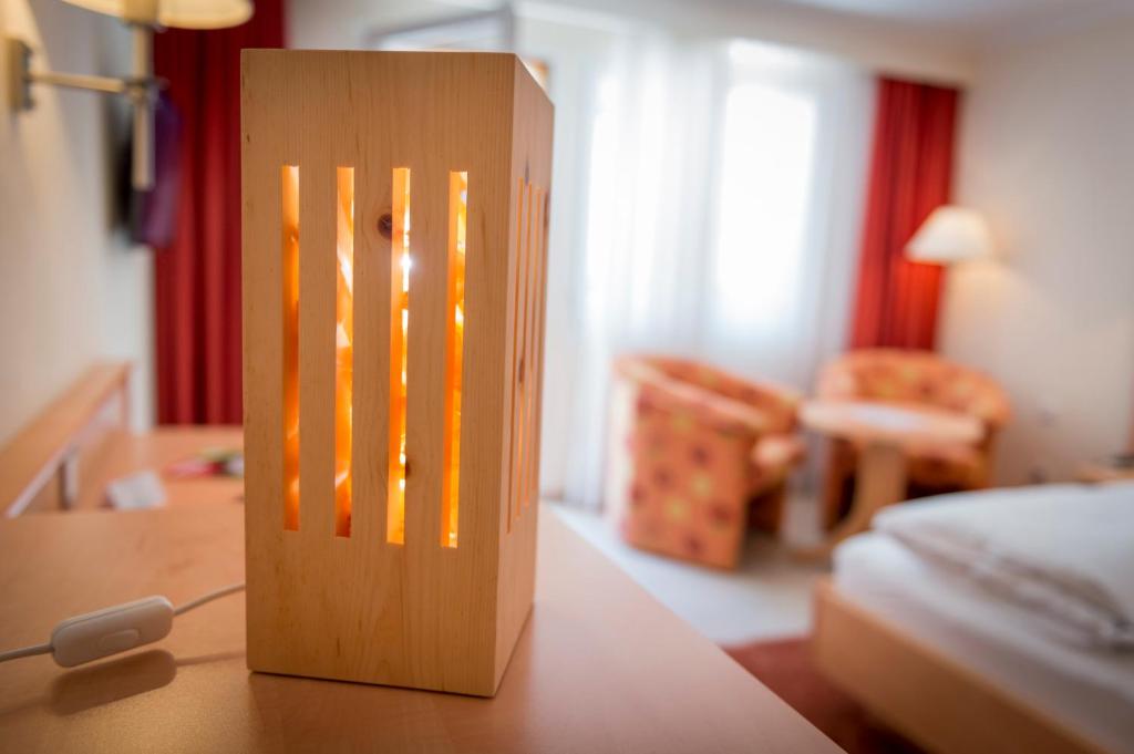 Postel nebo postele na pokoji v ubytování Alpenresort Eienwäldli Engelberg