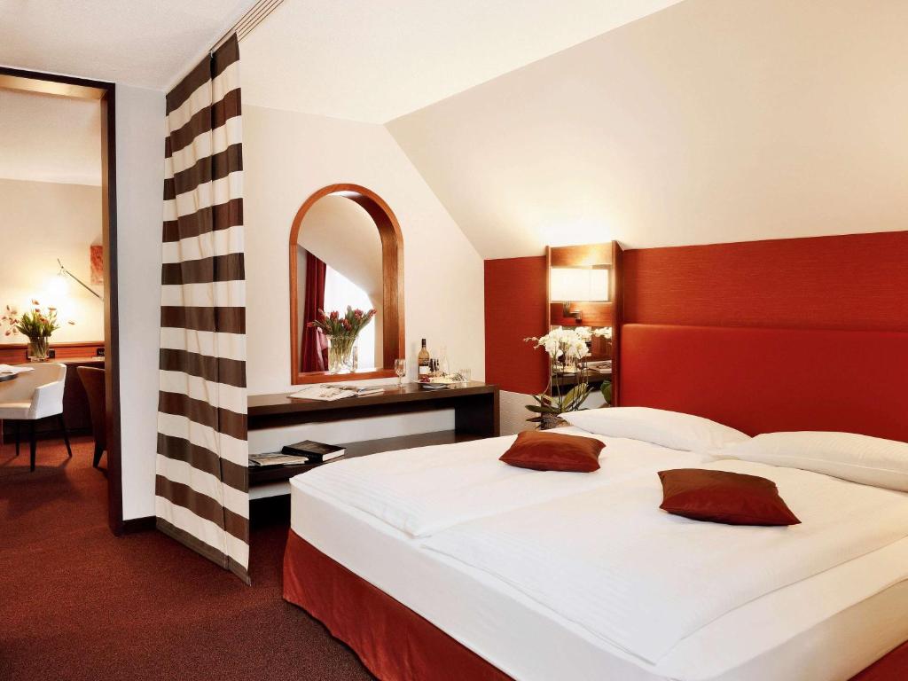 Postel nebo postele na pokoji v ubytování Mövenpick Hotel Egerkingen