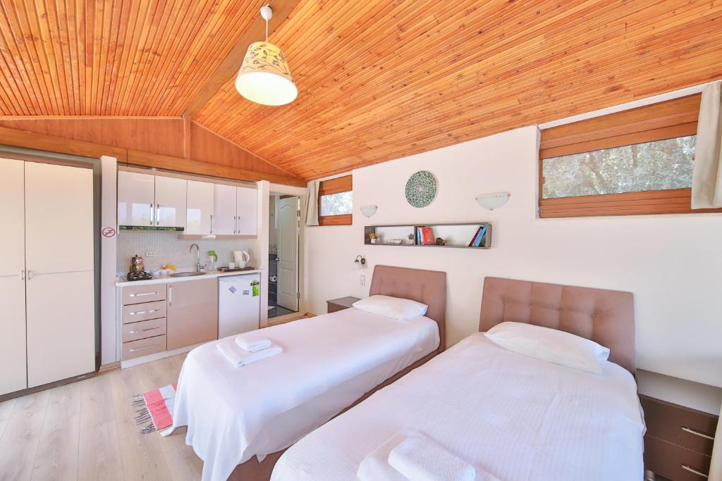 Postel nebo postele na pokoji v ubytování Villa Dundar - Kas Apartments