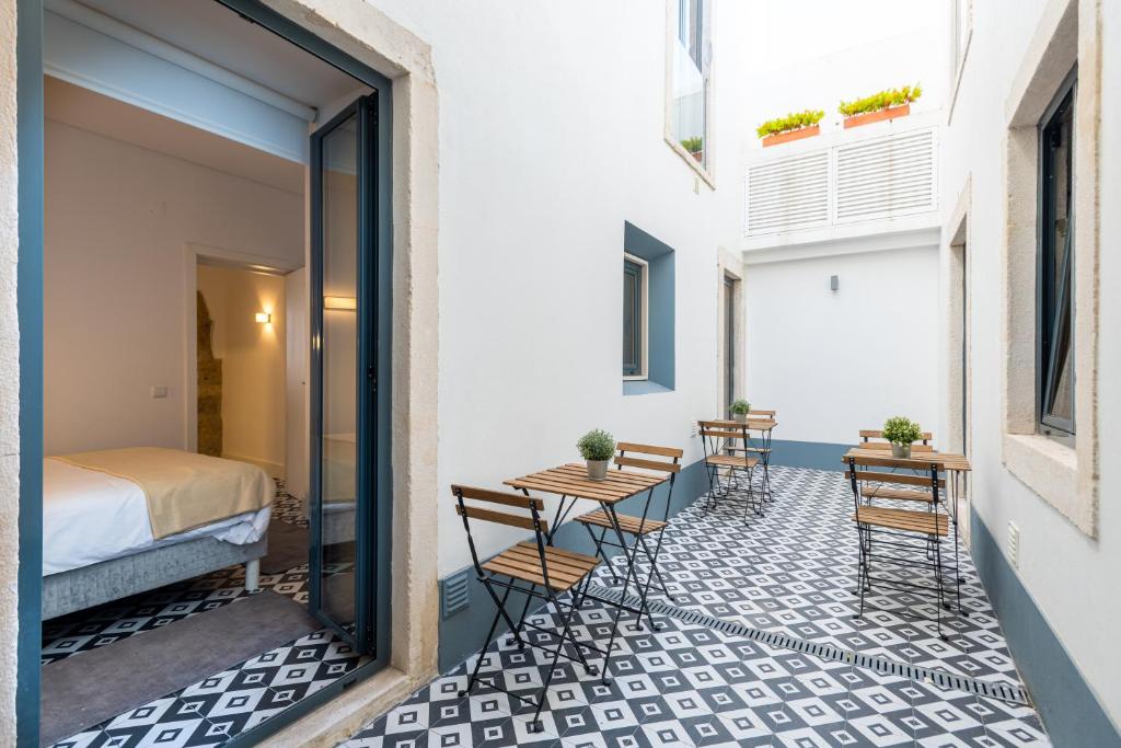 Uma cama ou camas num quarto em Villa Graça -Hostels and Apartments