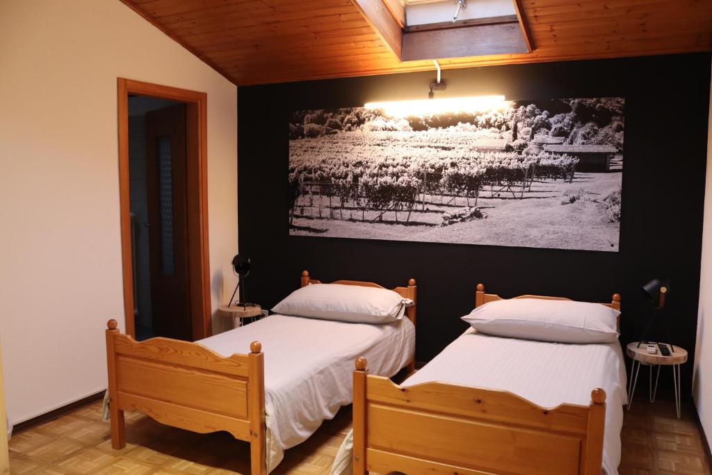 Postel nebo postele na pokoji v ubytování Borgovecchio Albergo