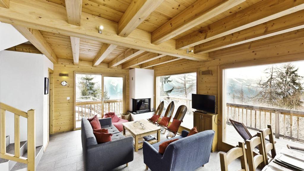 a living room with a couch and chairs at Ann LANDSCAPED & LUXE chalet 8 pers by Alpvision Résidences in Nendaz