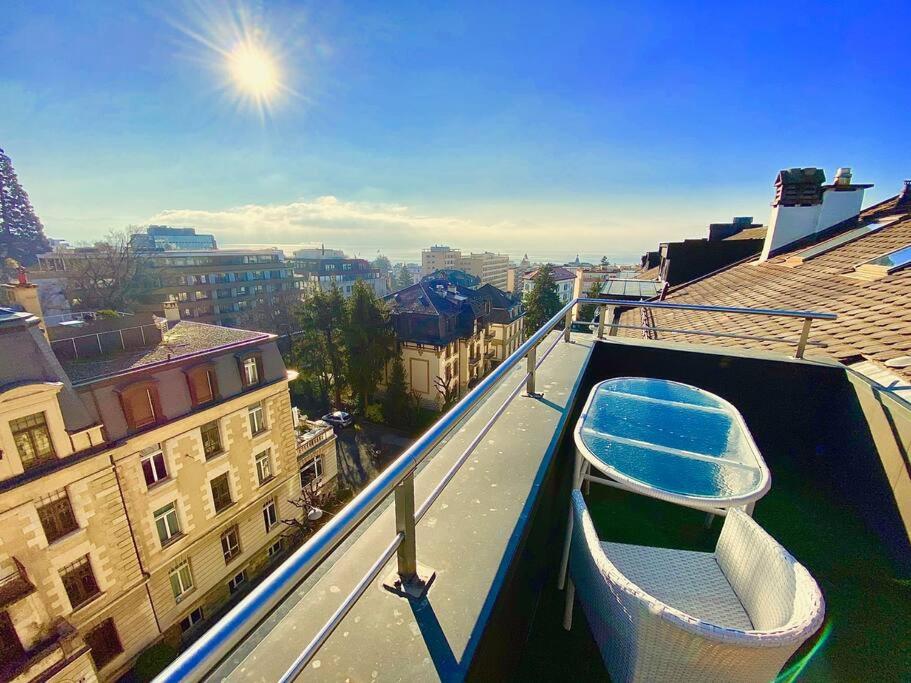 a gondola sitting on the roof of a building at Penthouse between lake, Ouchy and city center in Lausanne