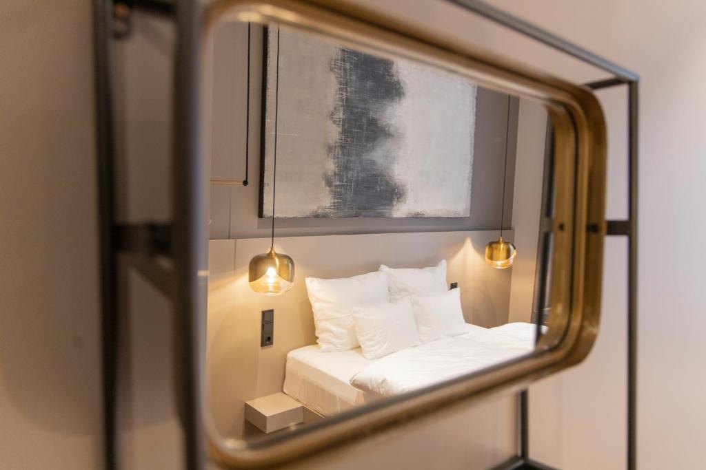 Postel nebo postele na pokoji v ubytování Munich Rooms Hotel