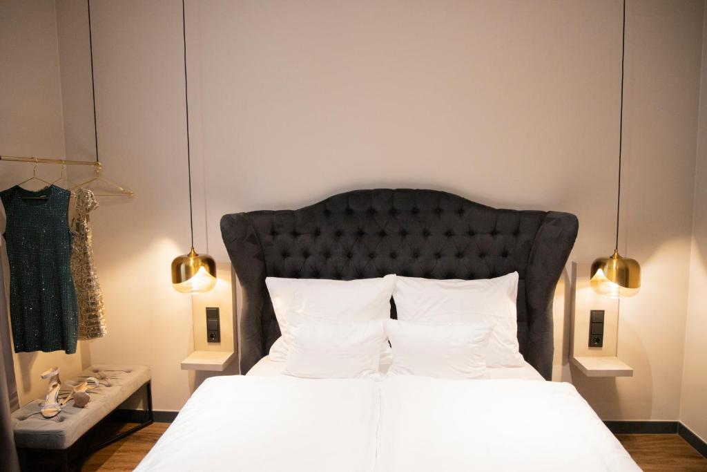 Postel nebo postele na pokoji v ubytování Munich Rooms Hotel