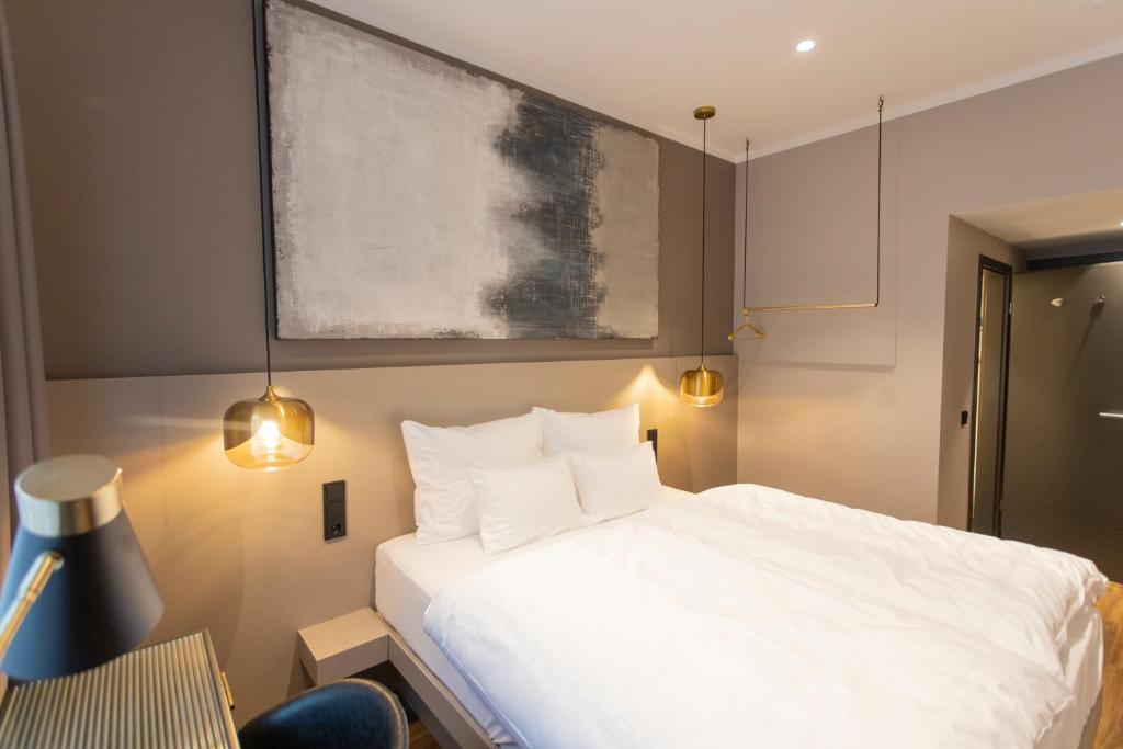 Postel nebo postele na pokoji v ubytování Munich Rooms Hotel