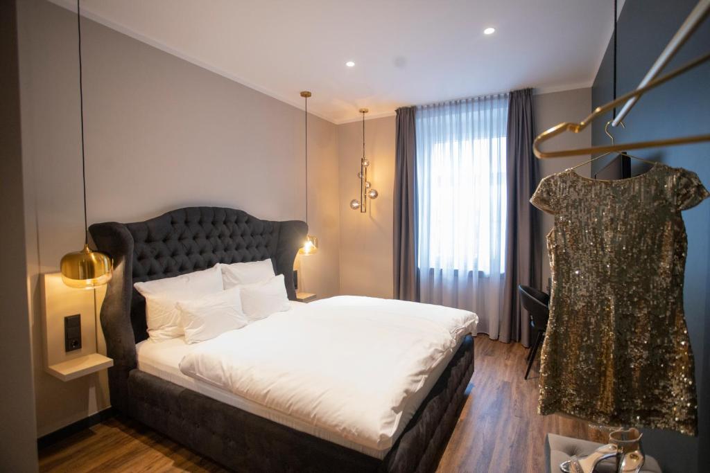 Postel nebo postele na pokoji v ubytování Munich Rooms Hotel