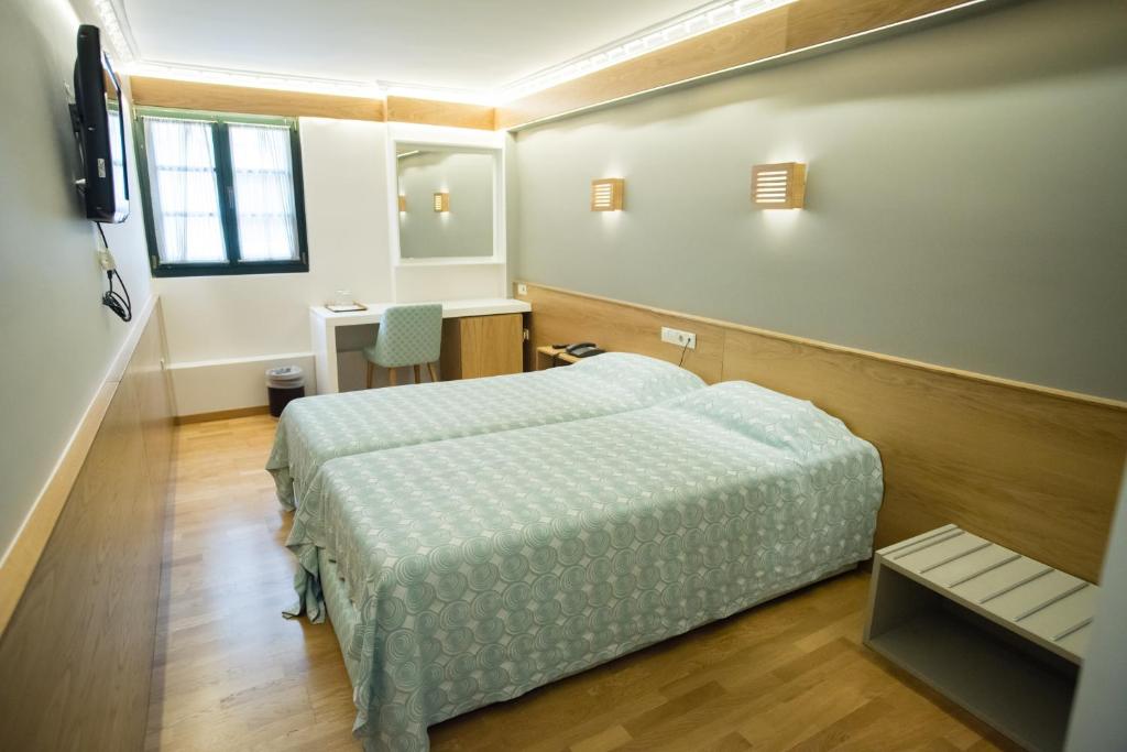 Postel nebo postele na pokoji v ubytování Byzantino Hotel