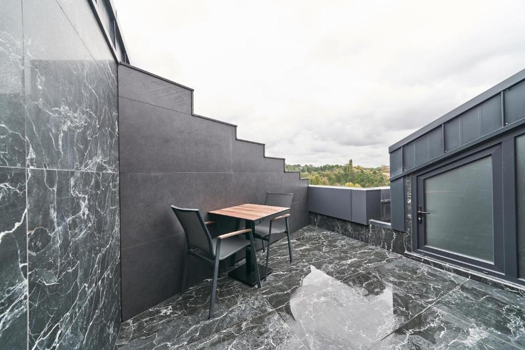 a balcony with a table and chairs on a building at Selini Hotel İstanbul Airport in Istanbul