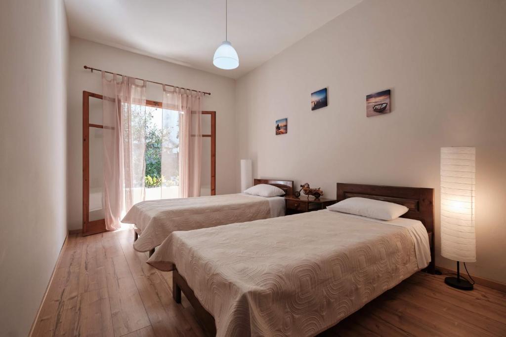 Postel nebo postele na pokoji v ubytování Olive Garden Studios & Apartments