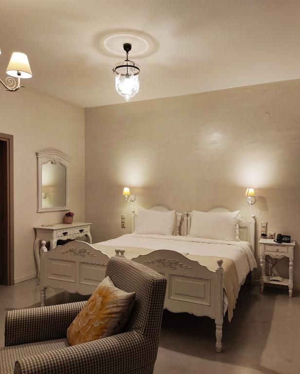 A bed or beds in a room at Haones Suites