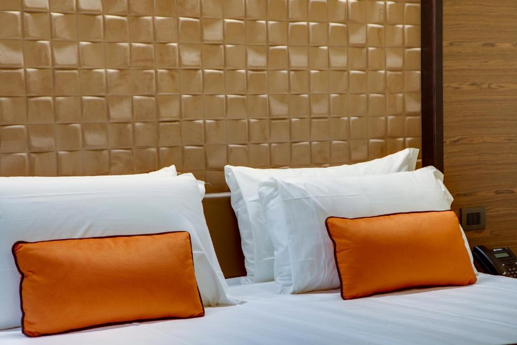 Łóżko lub łóżka w pokoju w obiekcie Solo Experience Hotel