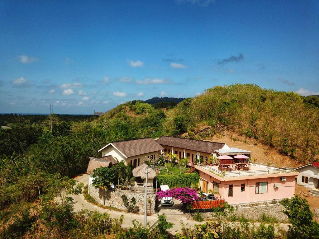 an aerial view of a house on a hill at Surf Camp 79 in Kuta Lombok