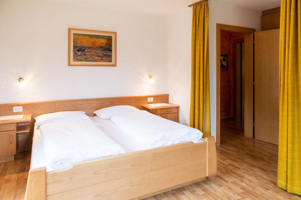Postel nebo postele na pokoji v ubytování Garni Juri