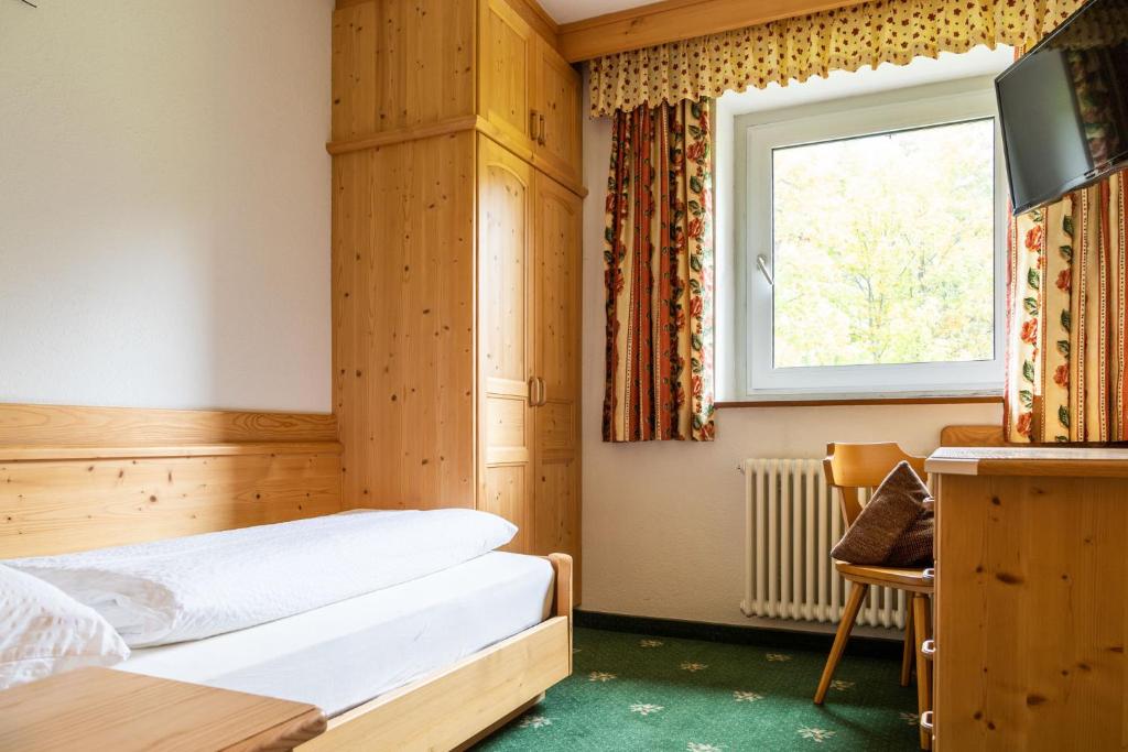 Postel nebo postele na pokoji v ubytování Garni Juri