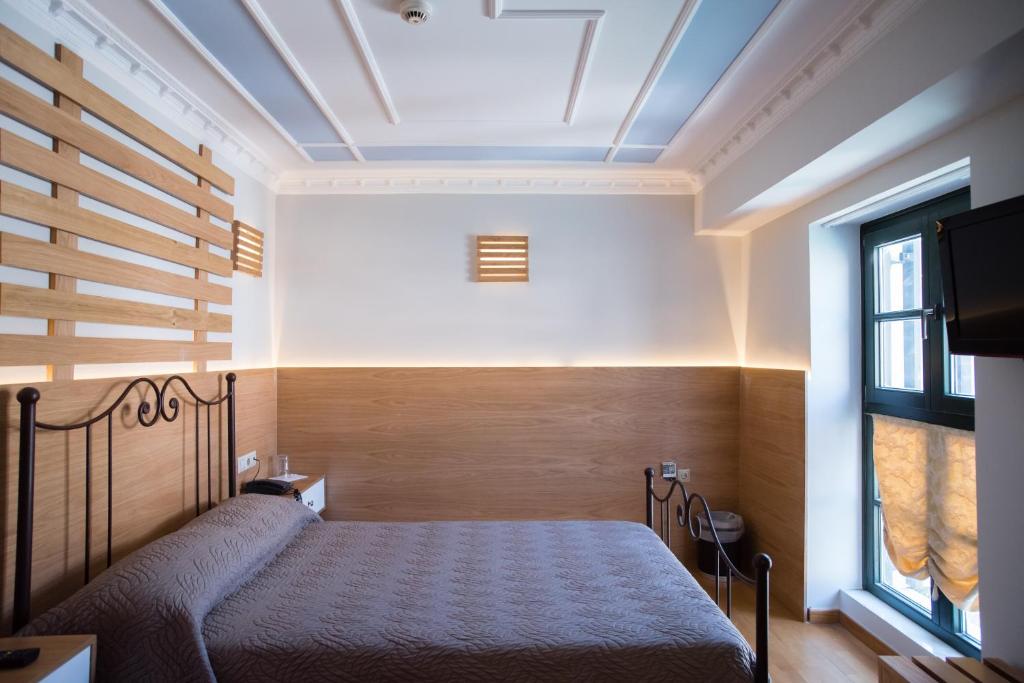 Postel nebo postele na pokoji v ubytování Byzantino Hotel