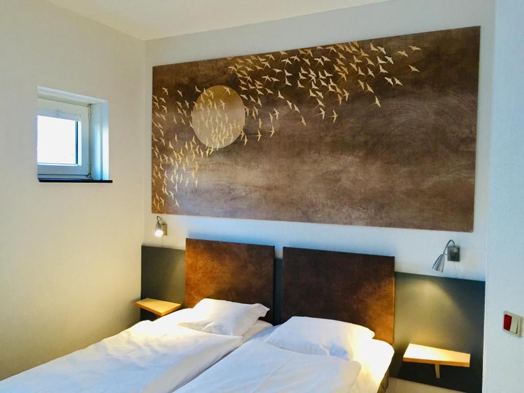 Postel nebo postele na pokoji v ubytování City Hotel Nattergalen
