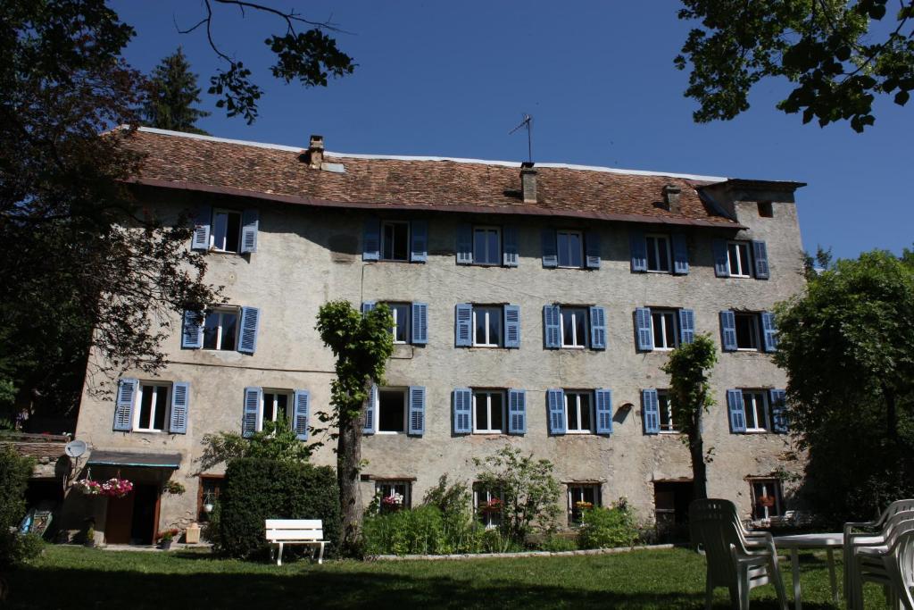 a large stone building with a lot of windows at Gîtes La Draperie in Beauvezer