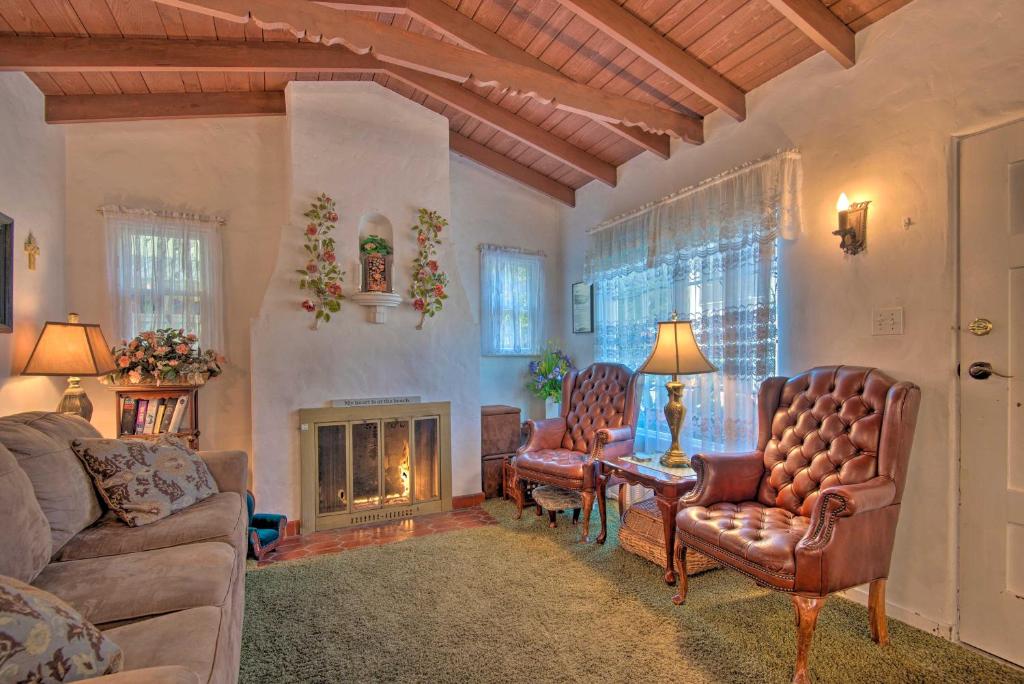 a living room with a couch and chairs and a fireplace at Avalon Escape Everything Within Walking Distance! in Avalon