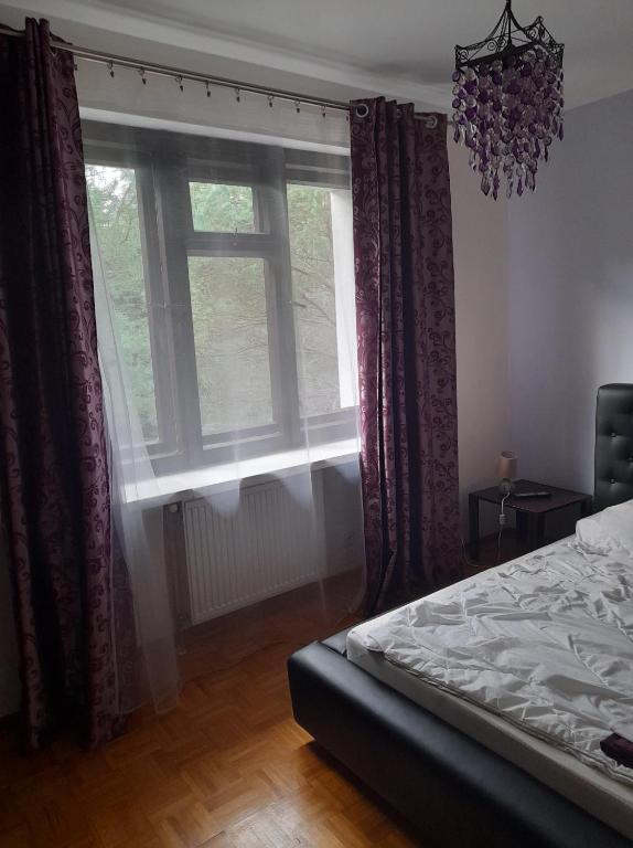 Posteľ alebo postele v izbe v ubytovaní Pensjonacik Zacisze