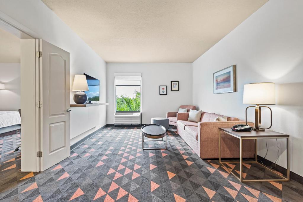 a living room with a couch and a table at Holiday Inn - St. Petersburg West by IHG in St Petersburg
