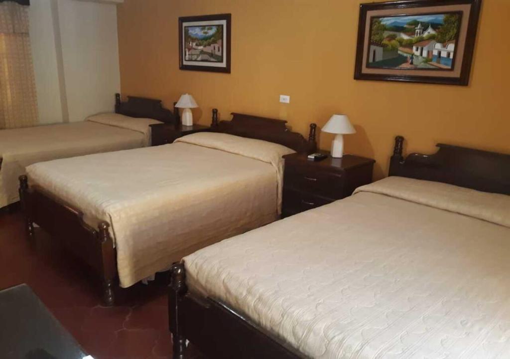 Voodi või voodid majutusasutuse Hotel Acropolis Maya toas