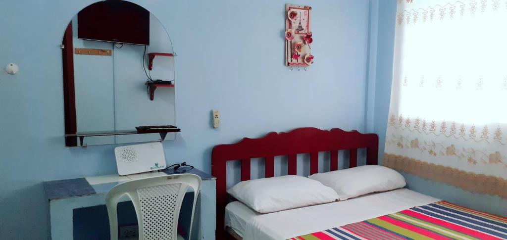 Postel nebo postele na pokoji v ubytování Hostal Aruba
