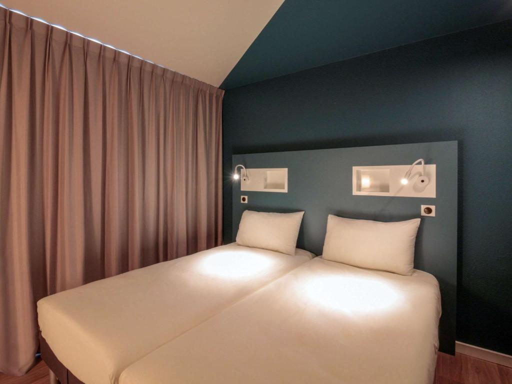 Postel nebo postele na pokoji v ubytování ibis budget Cahors