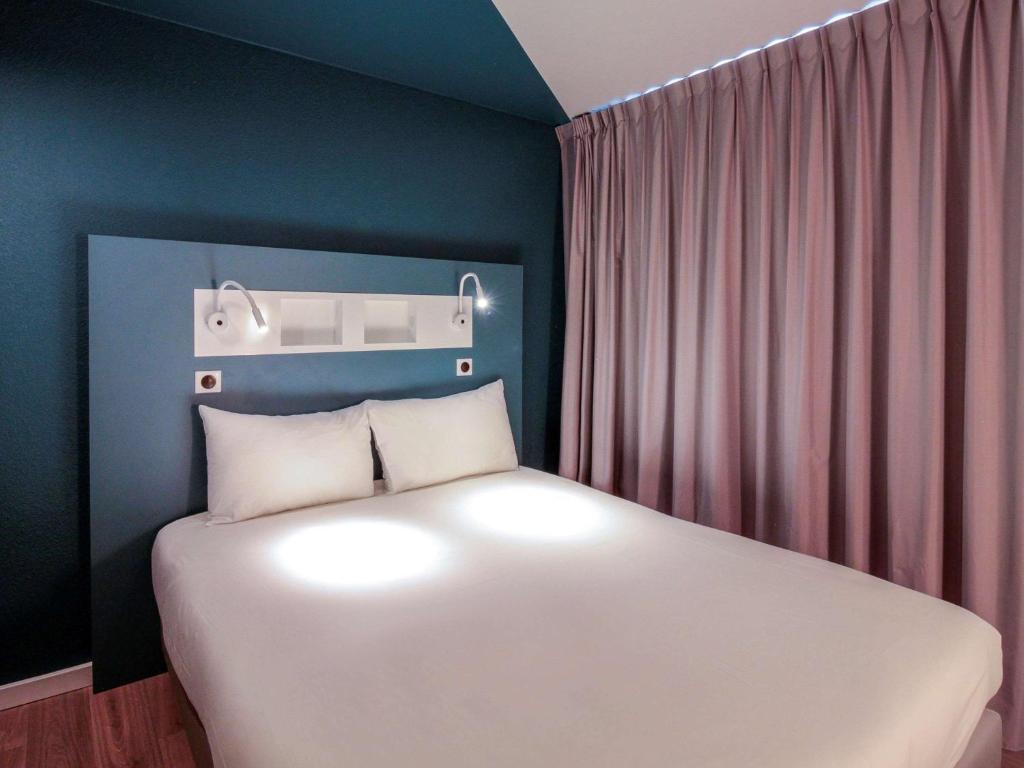 Postel nebo postele na pokoji v ubytování ibis budget Cahors