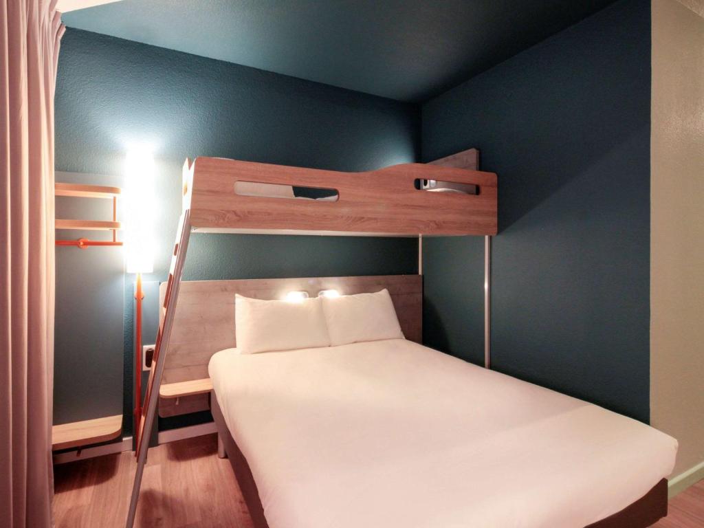 Postel nebo postele na pokoji v ubytování ibis budget Cahors