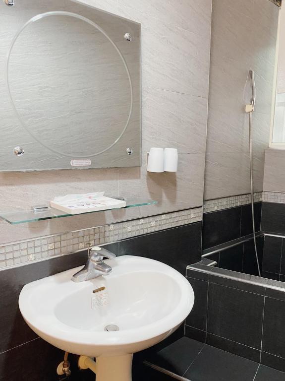 Koupelna v ubytování H Hotel