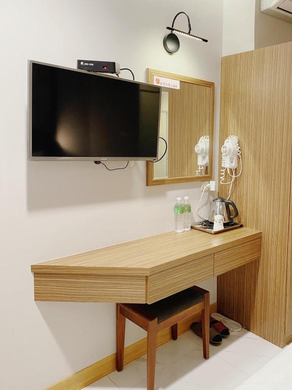 TV a/nebo společenská místnost v ubytování H Hotel