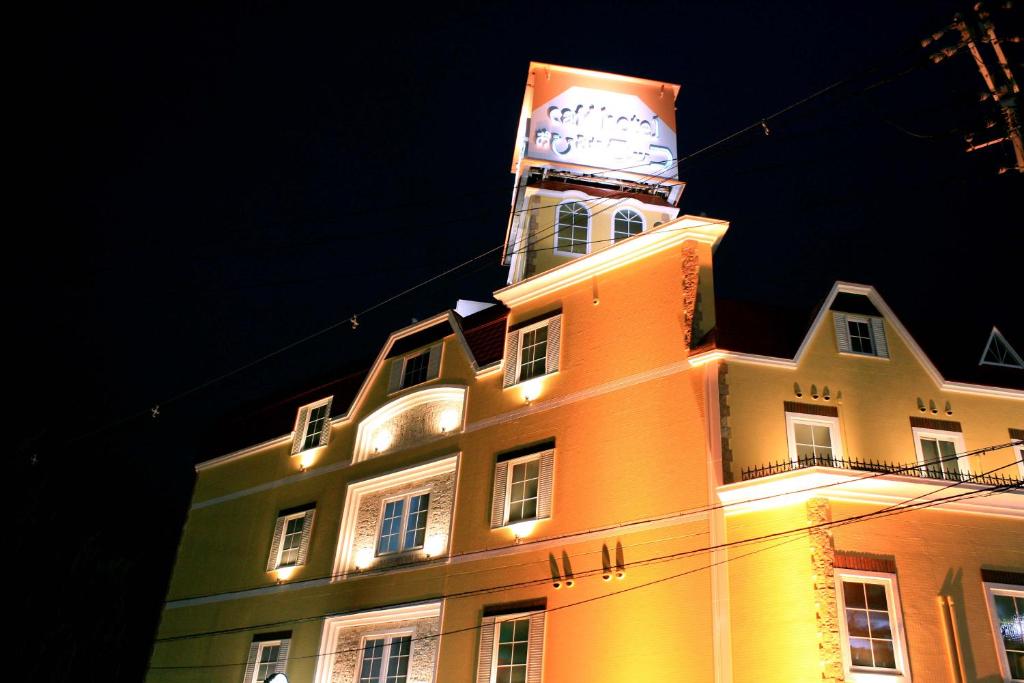 a building with a clock tower on top of it at Hotel Ohirune Racco Sakai (Adult Only ) in Sakai