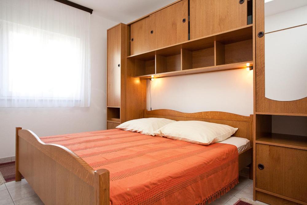 Łóżko lub łóżka w pokoju w obiekcie Apartments Mato