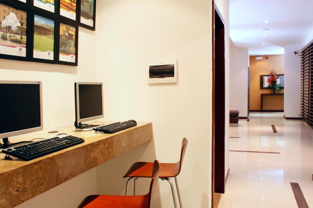 TV a/nebo společenská místnost v ubytování Hotel Estelar El Cable