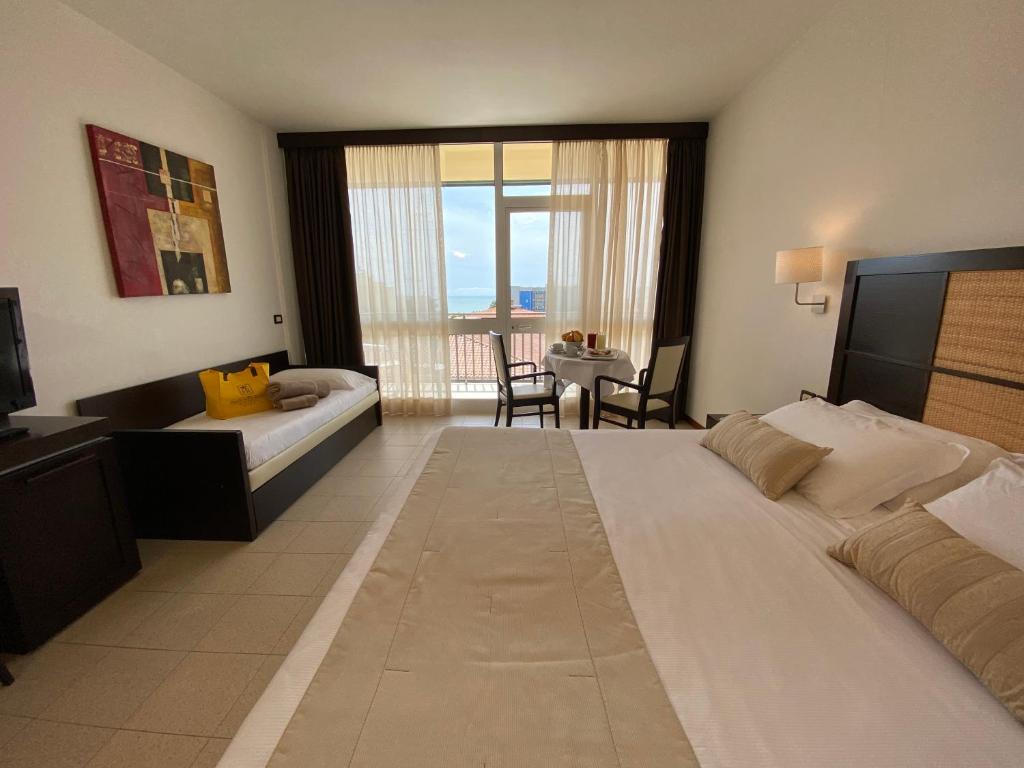 Postel nebo postele na pokoji v ubytování Palace Hotel Regina