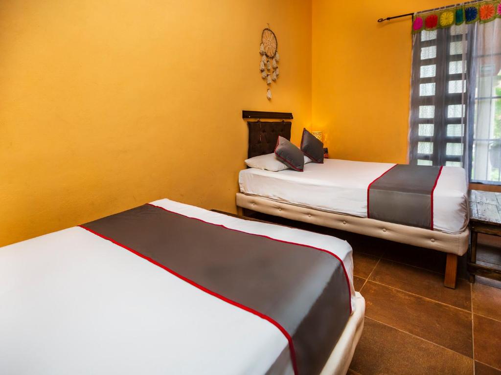 Postel nebo postele na pokoji v ubytování Casa Aluxes Hotel