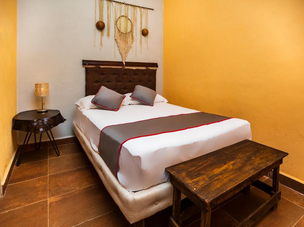 Postel nebo postele na pokoji v ubytování Casa Aluxes Hotel