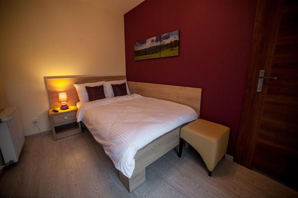 Posteľ alebo postele v izbe v ubytovaní Rezydencja Pod Ochorowiczówką B&B
