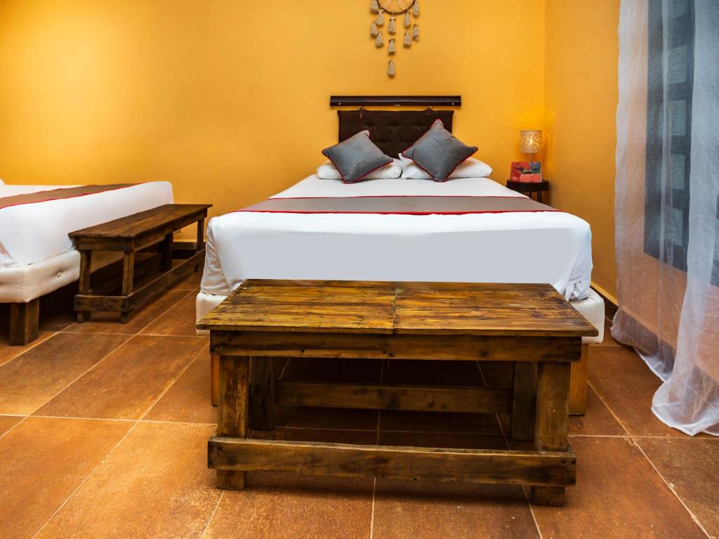 Postel nebo postele na pokoji v ubytování Casa Aluxes Hotel