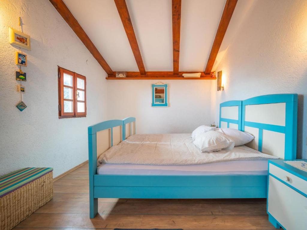 Postel nebo postele na pokoji v ubytování Holiday Home Mickey by Interhome