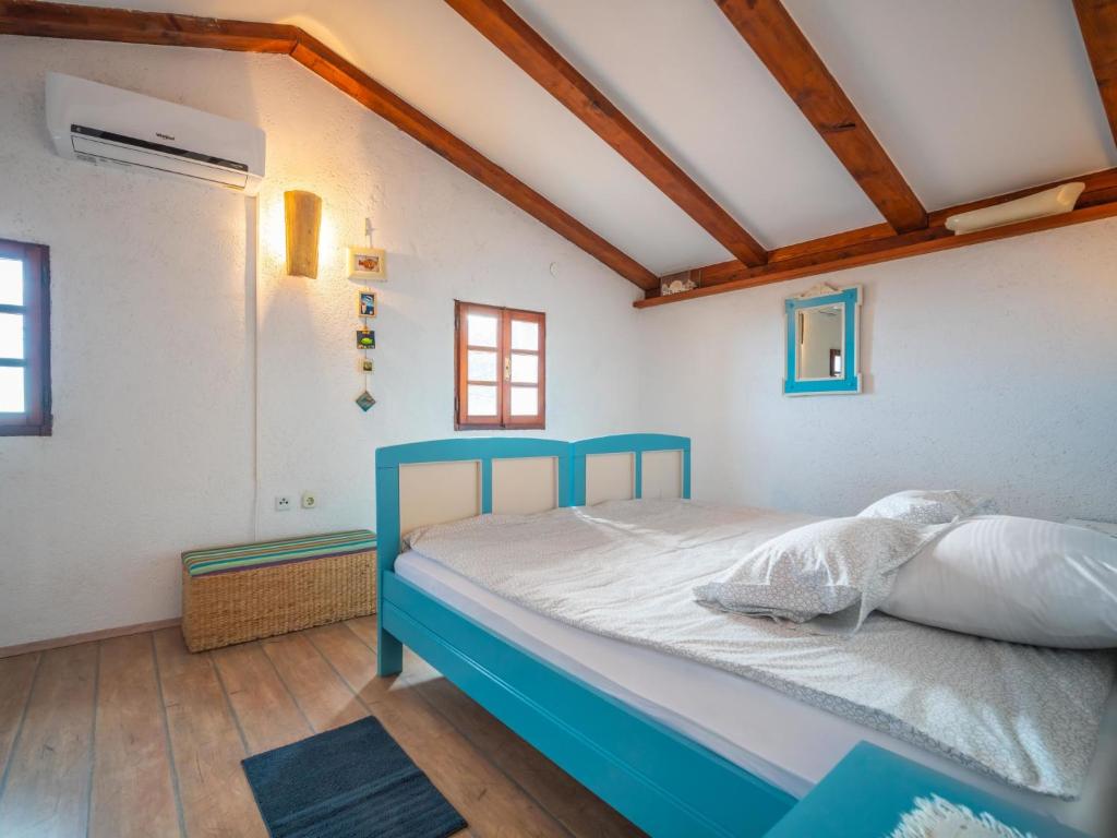 Postel nebo postele na pokoji v ubytování Holiday Home Mickey by Interhome