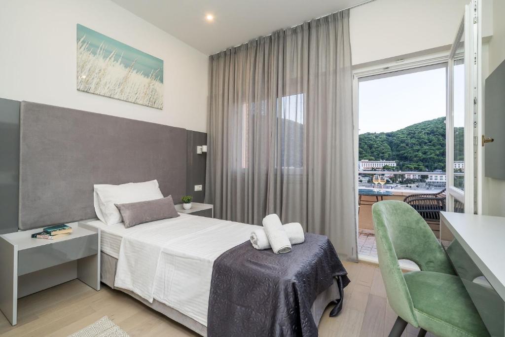 Postel nebo postele na pokoji v ubytování Art Hotel Dubrovnik